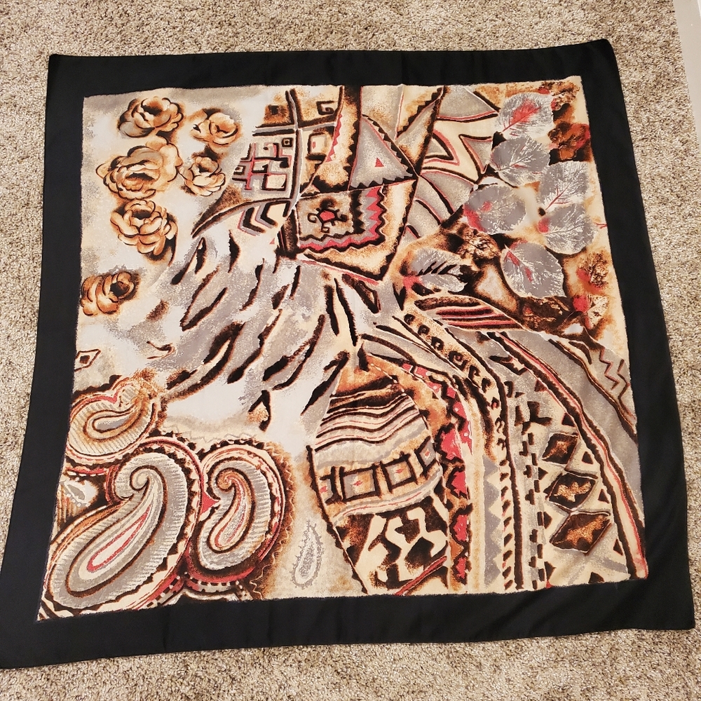 scarf with a black outline and a multi-colored abstract floral and paisley